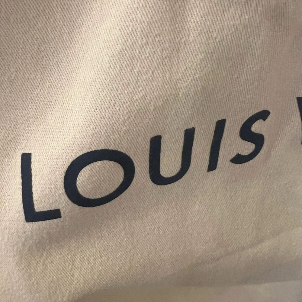 Louis Vuitton Cream garnet travel bag